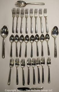 Set of Sterling Silver Flatware by Gorham in the Camilla Pattern; 1160 grams excluding dinner knives (shown separately).  