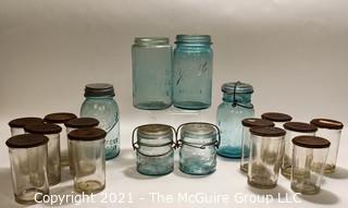 Selection of Vintage Blown Glass Canning Supplies and Baby Brand Condensed Milk Jars with Lids.