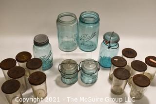 Selection of Vintage Blown Glass Canning Supplies and Baby Brand Condensed Milk Jars with Lids.