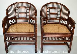 Two (2) Asian Style Rattan Arm Chairs with Cane Seats.  Measure 34" x 22" x 20".