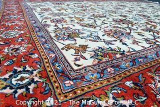 Hand Woven Persian Wool Rug with Botanical Design on White Ground with Red Border.  Measures 87" x 120"