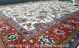 Hand Woven Persian Wool Rug with Botanical Design on White Ground with Red Border.  Measures 87" x 120"