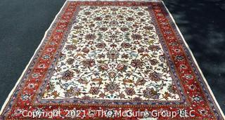 Hand Woven Persian Wool Rug with Botanical Design on White Ground with Red Border.  Measures 87" x 120"