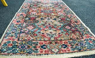 Hand Woven Persian Rug on White Ground. Measures approximately 26" x 49".