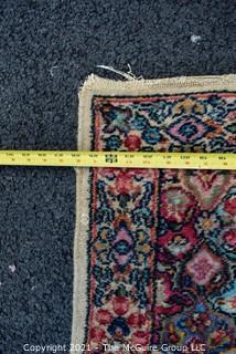 Hand Woven Persian Rug on White Ground. Measures approximately 26" x 49".