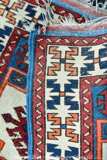 Hand Woven Persian Rug with Geometric Pattern. Measures approximately 26" x 49".