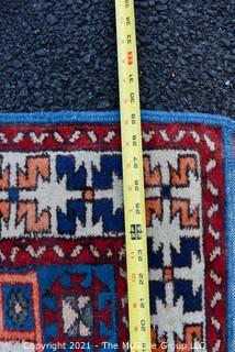 Hand Woven Persian Rug with Geometric Pattern. Measures approximately 26" x 49".