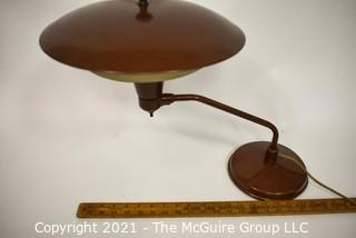 Mid Century Swiveling Table Lamp with Tiered Metal Saucer Shade. Measures 17" tall.