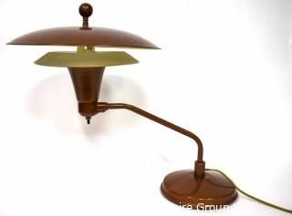 Mid Century Swiveling Table Lamp with Tiered Metal Saucer Shade. Measures 17" tall.