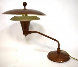 Mid Century Swiveling Table Lamp with Tiered Metal Saucer Shade. Measures 17" tall.