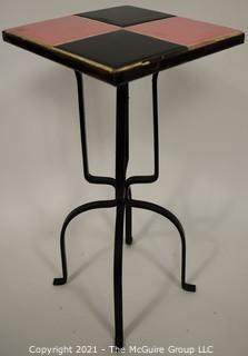 Vintage Wrought Iron Table with Pink and Black Tile Insert. Measures 19" tall and and 9" square.