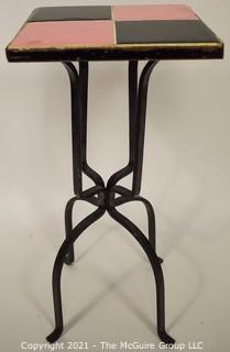 Vintage Wrought Iron Table with Pink and Black Tile Insert. Measures 19" tall and and 9" square.