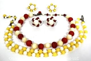 Two (2) Matching Sets Demi Parure in Yellow & Red Porcelain Beads.  Includes Adjustible Necklaces & Clip On Earrings.  Made in Japan. 