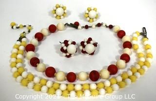 Two (2) Matching Sets Demi Parure in Yellow & Red Porcelain Beads.  Includes Adjustible Necklaces & Clip On Earrings.  Made in Japan. 