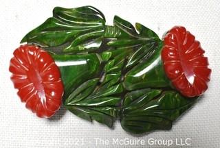 Vintage Green & Red Carved Bakelite Flower Brooch.  Measures 3" long. 