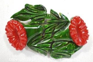 Vintage Green & Red Carved Bakelite Flower Brooch.  Measures 3" long. 