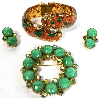 Group of Mid Century Vintage Jewelry.  Includes faceted Rhinestone Circle Brooch with Matching Clip On Earrings and Lucite Hinged Cuff Bracelet with Gold Confetti Glitter. 