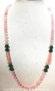 Opera Length Knotted Pink & Green Gemstone Beaded Necklace.  Measure 30" long.