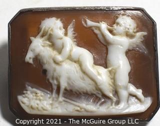 Antique Victorian Hand Carved Shell Cameo Brooch Set In Silver with Cherubs and a Goat.  Measures 1 1/4" x 1" 