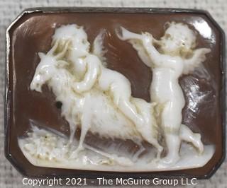 Antique Victorian Hand Carved Shell Cameo Brooch Set In Silver with Cherubs and a Goat.  Measures 1 1/4" x 1" 