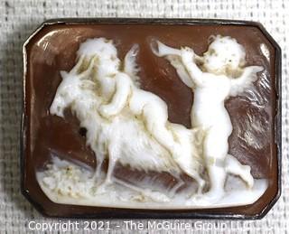 Antique Victorian Hand Carved Shell Cameo Brooch Set In Silver with Cherubs and a Goat.  Measures 1 1/4" x 1" 