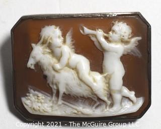 Antique Victorian Hand Carved Shell Cameo Brooch Set In Silver with Cherubs and a Goat.  Measures 1 1/4" x 1" 