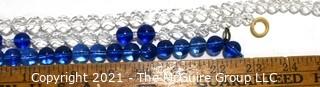 Four (4) Strands of Clear and Cobalt Blue Crystal Faceted Beads. 