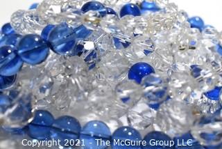 Four (4) Strands of Clear and Cobalt Blue Crystal Faceted Beads. 