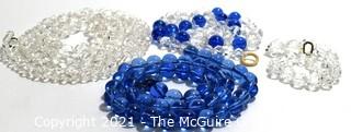 Four (4) Strands of Clear and Cobalt Blue Crystal Faceted Beads. 