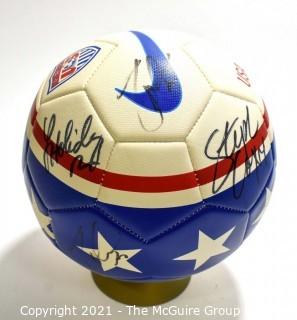 Autographed USA Soccer Ball from the 2008 Summer Olympics.  Signatures include Lauren Cheney Holiday, Stephanie Cox & Amy Rodriguez.  There are additional signatures that are illegible.  