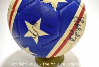 Autographed USA Soccer Ball from the 2008 Summer Olympics.  Signatures include Lauren Cheney Holiday, Stephanie Cox & Amy Rodriguez.  There are additional signatures that are illegible.  