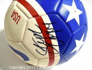 Autographed USA Soccer Ball from the 2008 Summer Olympics.  Signatures include Lauren Cheney Holiday, Stephanie Cox & Amy Rodriguez.  There are additional signatures that are illegible.  