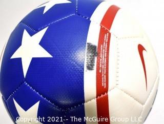 Autographed USA Soccer Ball from the 2008 Summer Olympics.  Signatures include Lauren Cheney Holiday, Stephanie Cox & Amy Rodriguez.  There are additional signatures that are illegible.  