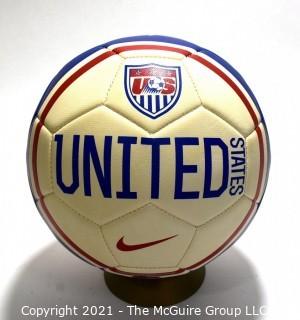 Autographed USA Soccer Ball from the 2008 Summer Olympics.  Signatures include Lauren Cheney Holiday, Stephanie Cox & Amy Rodriguez.  There are additional signatures that are illegible.  