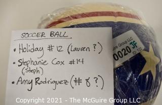 Autographed USA Soccer Ball from the 2008 Summer Olympics.  Signatures include Lauren Cheney Holiday, Stephanie Cox & Amy Rodriguez.  There are additional signatures that are illegible.  