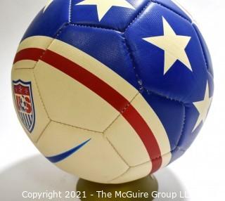 Autographed USA Soccer Ball from the 2008 Summer Olympics.  Signatures include Lauren Cheney Holiday, Stephanie Cox & Amy Rodriguez.  There are additional signatures that are illegible.  