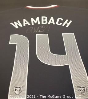 Framed and Professionally Mounted Signed Abby Wambach Team USA Women's Soccer Olympic Jersey.  Signed in Black Sharpie with her U.S. Olympic Team #20