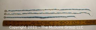 Three (3) Strands of Blue Glass and Mother of Pearl Beads. 