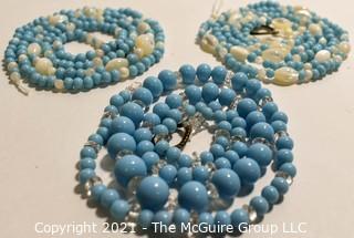 Three (3) Strands of Blue Glass and Mother of Pearl Beads. 