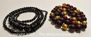 Two (2) Strands of Beads. One made of French Jet and the other lucite.