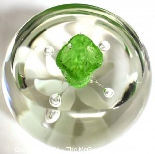 Vintage Round Hand Blown Lampwork Glass Paperweight with White & Green Flower. Measures 3" in diameter.