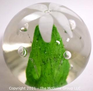 Vintage Round Hand Blown Lampwork Glass Paperweight with White & Green Flower. Measures 3" in diameter.