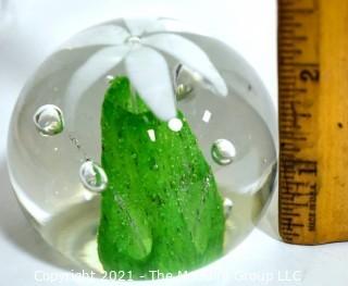 Vintage Round Hand Blown Lampwork Glass Paperweight with White & Green Flower. Measures 3" in diameter.