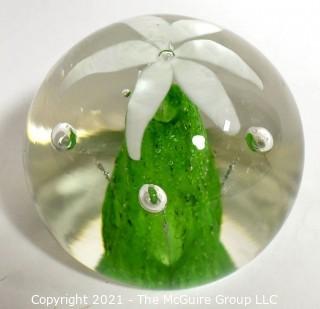 Vintage Round Hand Blown Lampwork Glass Paperweight with White & Green Flower. Measures 3" in diameter.