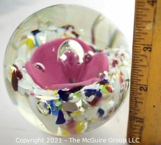 Vintage Round Hand Blown Lampwork Glass Paperweight with Pink Flower. Measures 3" in diameter.