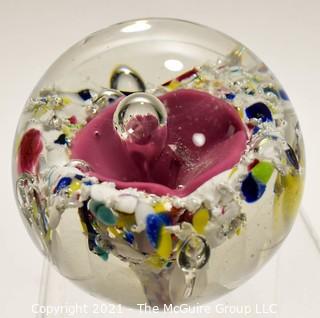 Vintage Round Hand Blown Lampwork Glass Paperweight with Pink Flower. Measures 3" in diameter.