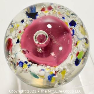 Vintage Round Hand Blown Lampwork Glass Paperweight with Pink Flower. Measures 3" in diameter.