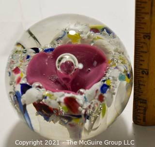 Vintage Round Hand Blown Lampwork Glass Paperweight with Pink Flower. Measures 3" in diameter.