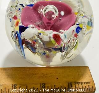 Vintage Round Hand Blown Lampwork Glass Paperweight with Pink Flower. Measures 3" in diameter.