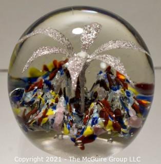 Vintage Round Hand Blown Lampwork Glass Paperweight with White Flower. Measures 3" in diameter.